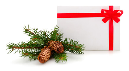 Christmas greeting envelope with red ribbon and pine branch isolated on white background