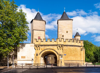 The Germans' Gate is a medieval bridge castle and city gate in Metz, France, with two round towers and two gun bastions, relic of the fortifications.