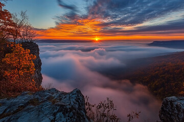 Fototapeta premium breathtaking dawn over fog-draped lake, where fiery hues of sunrise meet the cool mist