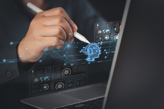 Hand with stylus activating AI neural interface over laptop dashboards for data analytics automation and smart decision making