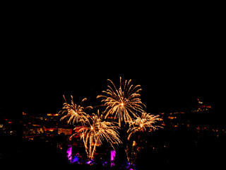 Spectacular fireworks over a historic city for festive events