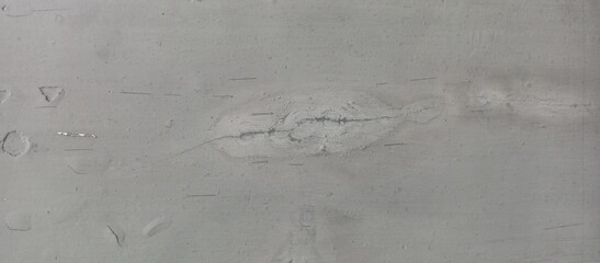 Subtle Light Gray Monochrome Wall Texture with Central Crack Mark