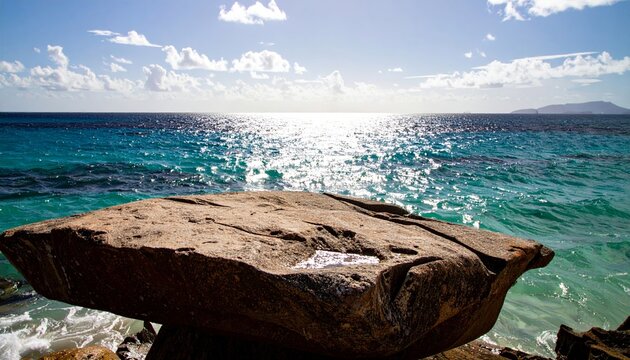 Weathered Rock Formation at the Edge of a Vibrant Sparkling Ocean