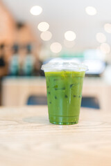 Iced pure matcha in a clear plastic cup with lid. A healthy summer drink