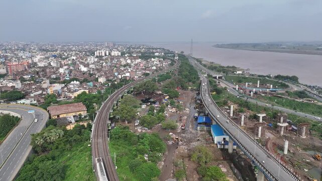 Evening view of Patna Marine Drive with JP Ganga Setu stretching across the Ganges in Bihar, India. A blend of modern infrastructure and riverside beauty, capturing city life, skyline, and tranquil wa