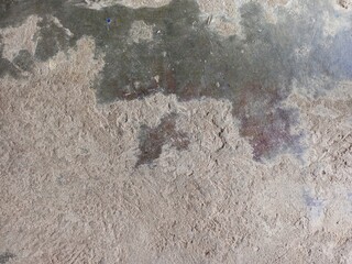 Rough Concrete Texture Contrast Between Dry Sand and Dark Wet Stains