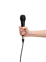 A person's hand holding a black wired microphone isolated against a plain white background.