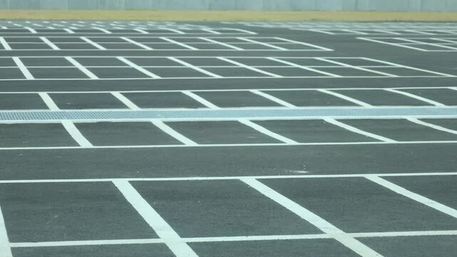 Large parking lot area with white lines as a divider