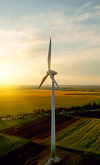 Wind turbine  are adopted renewable energy technologies used to generate electricity sustainably.Green energy reduces pollution and keeps the environment clean and sustainable. © Miha Creative