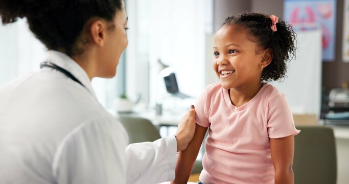 Appointment, medical and pediatrician with girl child in hospital for consulting or trust. Checkup, diagnosis or healthcare with doctor and kid patient in clinic for advice, healing or wellness