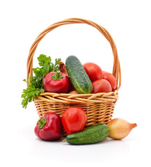 Basket with fresh vegetables isolated on white background.