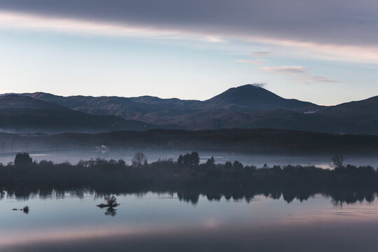 lake view at dawn in the copuntryside of montenegro, with reflections of trees in the water