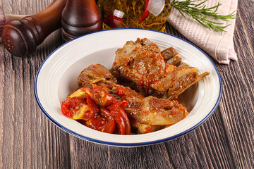 Baked lamb ribs with vegetables