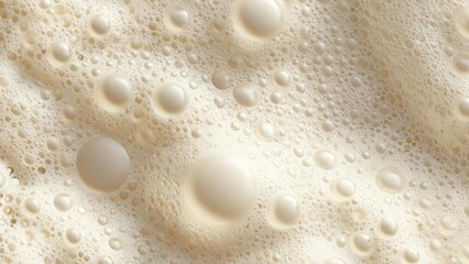 Close-up of creamy milk foam with bubbles of various sizes. Concept Creamy milk foam, Bubble texture, Macro close-up, Coffee art, Dairy detail