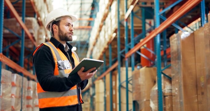 Man, logistics or checking inventory with tablet in warehouse for inspection, checklist or storage. Male person, supplier or distributor with technology for distribution, cargo or supply chain depot