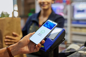 Close up of mobile payment at checkout