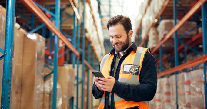 Supply chain, smartphone and man in warehouse, smile and email for shipping schedule. Happy person, employee and inspection in factory, cellphone and internet with distribution, app and logistics - Powered by Adobe