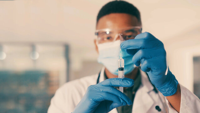 Portrait, doctor and black man with gloves for syringe, healthcare injection and flu shot for wellness. PPE, medical treatment and physician with needle for immune system, vaccine and health boost.