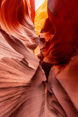 Deep Slot Canyon Passage with Strong Red and Orange Contrast
