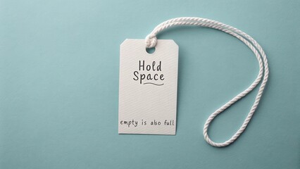 Inspirational tag design featuring the phrase "Hold Space" with the quote "empty is also full" on a blue background