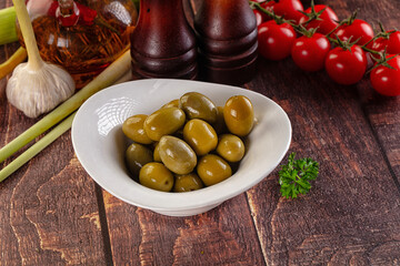 Greek green olives marinated in the bowl