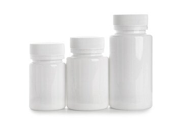 Blank plastic vitamin bottles on white background
