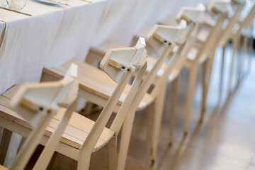 Minimalist White Chairs in Line for a wedding