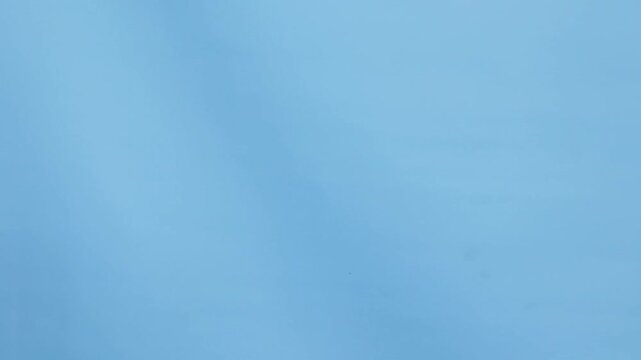 A hand holding a wooden set of prayer beads. This is usually used for zikr in Islam