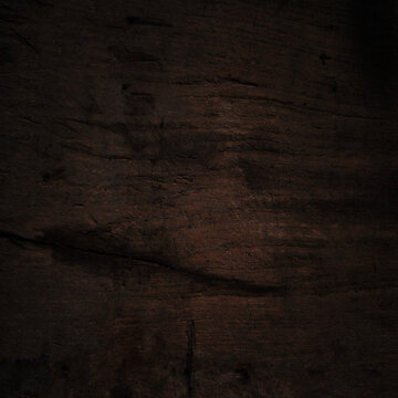 Horizontal close-up smooth dark wood featuring rich. Strong, soft vignette that fades edges into absolute black creating moody sophisticated and luxurious atmosphere elegant websites digital vintage