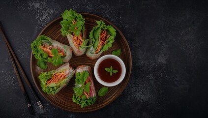 Colorful Culinary Arrangement Fresh Vegetable Rolls with a Rich Dipping Sauce.