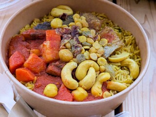 Authentic Emirati Machboos Samak (Spiced Fish and Rice) in a Takeout Bowl