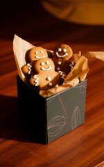 Gingerbread Man cookies presented in gift box display. Gingerbread Cookies decorated with frosting, icing. Christmas cookie.	