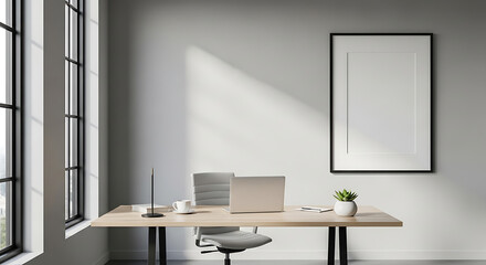 Modern home office with a minimalist wooden desk, laptop, ergonomic chair, large window, and a blank framed picture on a light grey wall with sunlight.