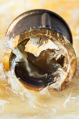 Brass coupling for water installations, immersed in technical grease