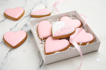 Gift box with sweet heart-shaped cookies on white background, closeup. Valentine's Day celebration