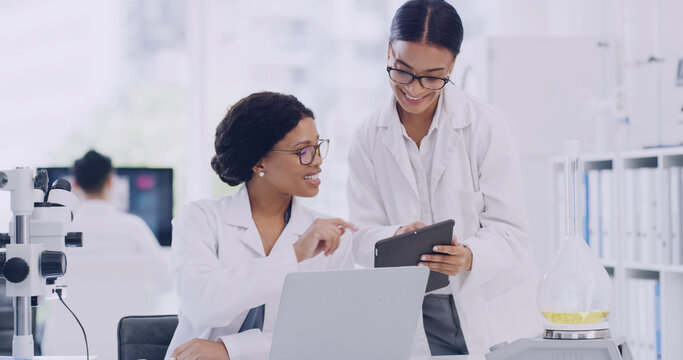 Collaboration, laptop and tablet with scientist people in laboratory for planning or research. App, science and smile with medical team at work on computer for clinical trial or experiment findings - Powered by Adobe