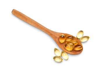 Wooden spoon with vitamin E capsules on white background