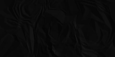 Black crumpled paper creased grunge texture. Paper wrinkled surface glued paper poster background. Crumpled and top view textures can be used for background of text or any contents.	