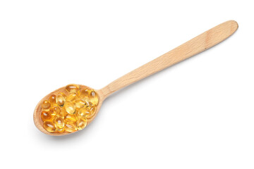 Wooden spoon with vitamin E capsules on white background