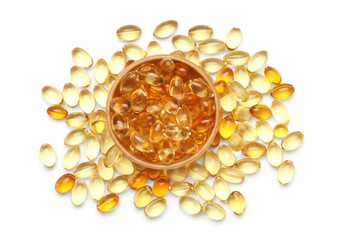 Bowl with vitamin E capsules on white background