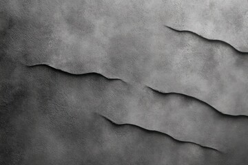 close-up of textured gray surface with irregular torn or cracked layers creating shadowed, uneven pattern