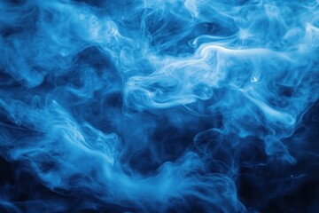 Fototapeta premium Swirling wisps of blue smoke creating an ethereal and mysterious atmosphere against a dark background
