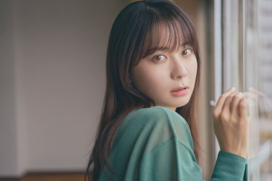 A Japanese woman in her twenties with long hair.