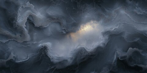 Close-up of dark swirling water with foam and bubbles creating abstract patterns with a subtle light reflection in the center