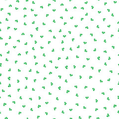 Ditzy green shamrocks seamless vector pattern background. Tossed three leaf clover on white backdrop. Irish lucky charm motifs. Scattered St. Patricks day symbols for celebration background.
