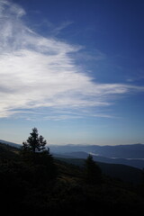 Mountain landscapes with mist, clouds and morning light in the Carpathians