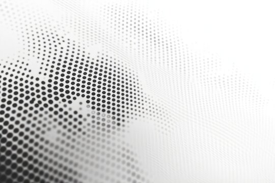 Abstract pattern of varying sized black dots on a white background creating a gradient halftone effect with a smooth transition from dense to sparse dot arrangement