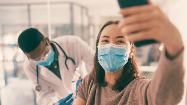 Smile, woman and selfie with doctor for vaccine injection, photography and awareness on social media. People, face mask and profile picture of pandemic treatment, medical procedure and healthcare ppe