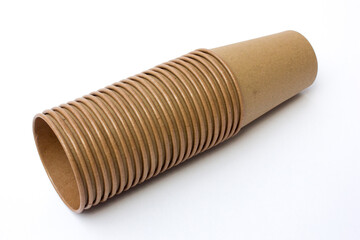 Several stacks of brown paper coffee cups isolated on white background. These cups are eco- friendly, suitable for coffee businesses in cafes.