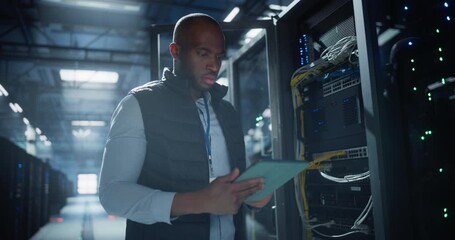Data center technician inspects server racks, checks network cables, and uses a tablet to monitor hardware status. Rows of illuminated servers, digital infrastructure, and secure network operations. - Powered by Adobe